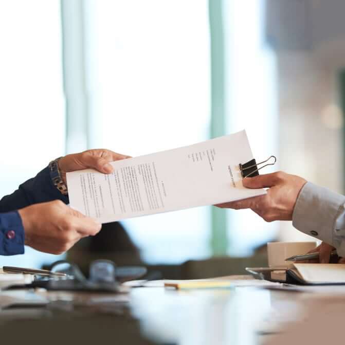 People exchanging documents.